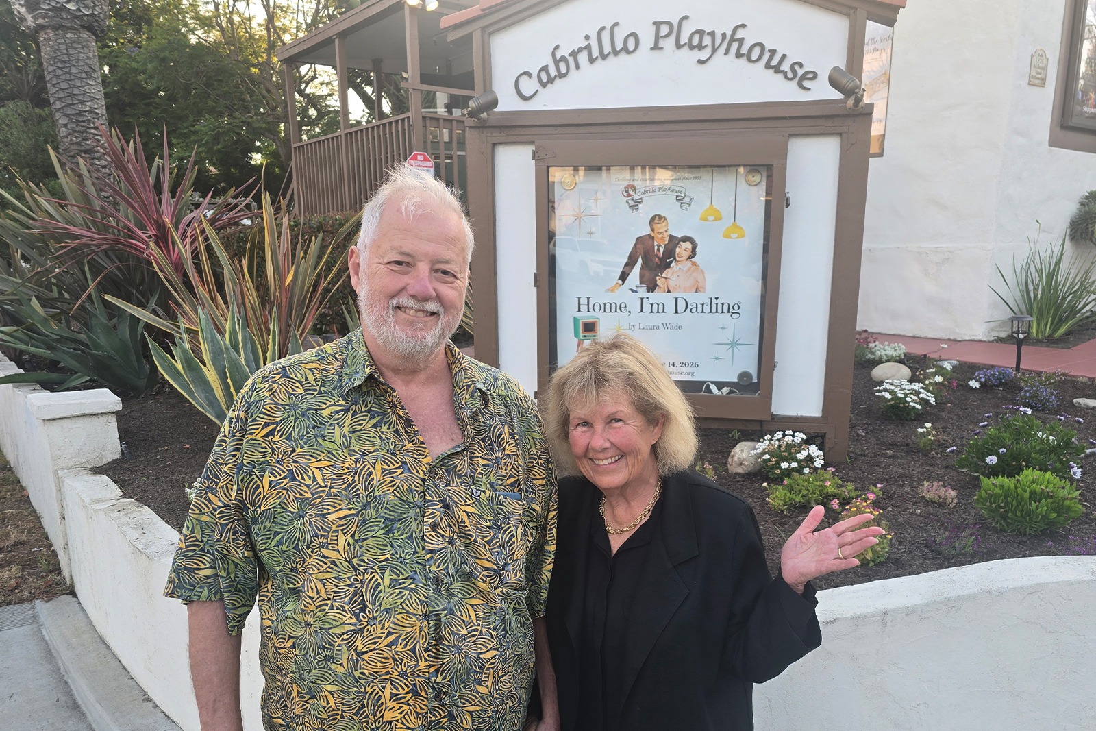 Donna Vidrine smiling with a community member outdoors