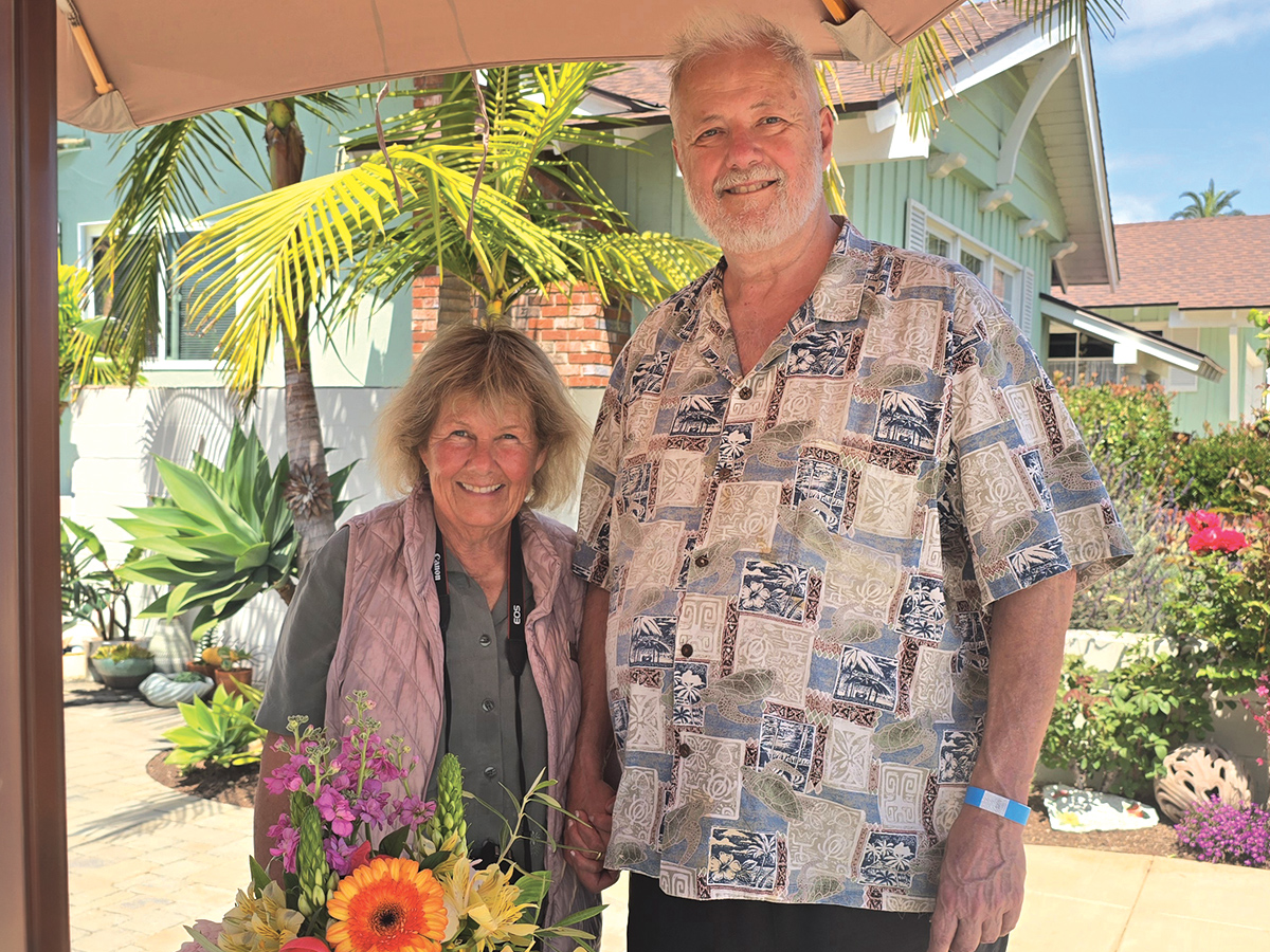 Donna Vidrine with flowers at an outdoor event